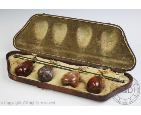 A set of brass and polished hard stone tapestry weights, the brass bar with agate terminals set with four agate and jasper st