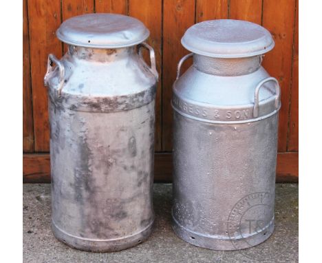 Two vintage milk churns and covers, the shorter 69cm H