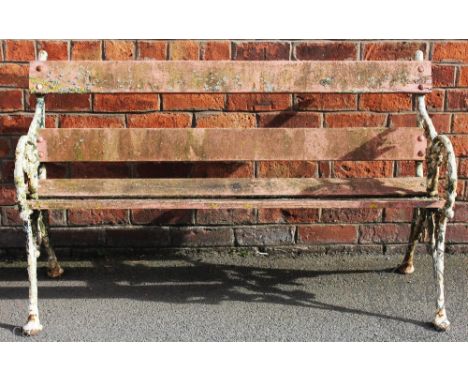 A Coalbrookdale style cast iron garden bench, with slatted back and seat, 138cm W CONDITION REPORT: The age of the bench is u