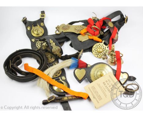 A collection of vintage horse brasses and tack accessories, to include a black and brass bridle with makers plate for Pearse 
