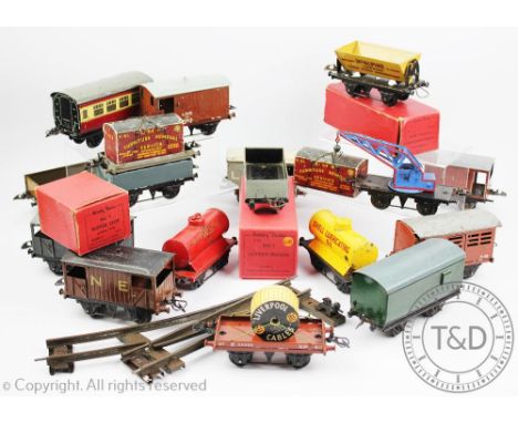 A collection of Hornby 'O' rolling stock etc, comprising thirty three wagons including LMS No 1 Hopper Wagon and R174 Wagon A