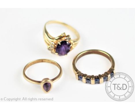 Three gem set rings, to include an abstract amethyst ring in yellow metal stamped '14K', weight 3.4gms and two further 9ct ge
