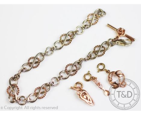 A Clogau Gold decorative link bracelet, stamped '925', and three removeable/interchangeable 9ct Clogau Gold charms, with orig