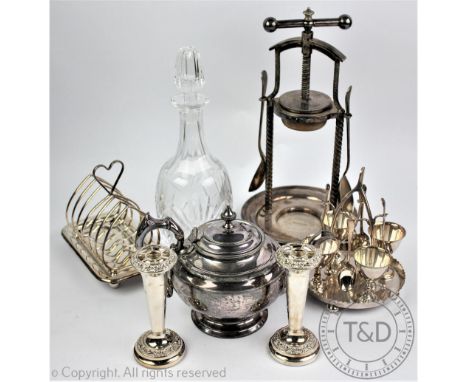 A military silver plated lemon or fruit squeezer, bearing 'Rd92938', 35cm high with a silver plated egg cruet, the central su