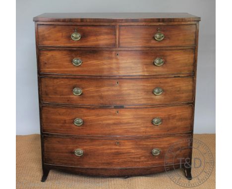 A Regency mahogany bow front chest, of two short and four graduated long drawers, on splayed bracket feet, 124.5cm H x 115cm 