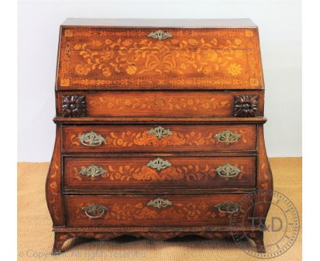 A late 18th / early 19th century Dutch inlaid oak bombe bureau, with fall enclosing a fitted interior, over two side drawers 