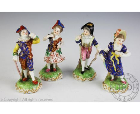 A set of four Derby allegorical figures, each in theatrical dress, and decorated in polychrome enamels, puce red marks to bas