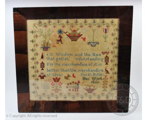 A Victorian needlework sampler by Sarah Butler dated 1860, worked with a verse, flowers, birds and animals within a floral bo