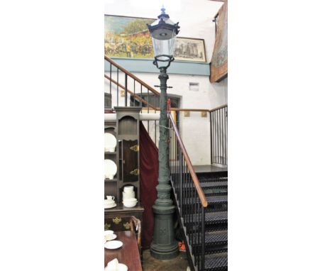 A 19th century style cast iron electric street lamp, with tapering hexagonal lantern top and cast foliate detailing, 328cm hi