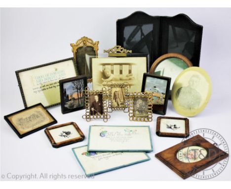 A collection of seventeen vintage photograph frames, including brass, treen and leather examples, (Qty)