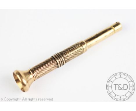 A 9ct yellow gold cigar piercer Chester 1927, with engine turned detail, gross weight 15.3gms, 8cm long 