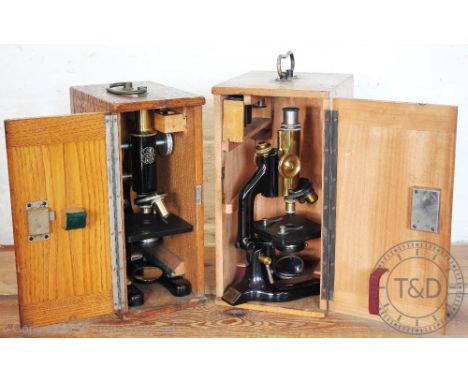 A C. Reichert microscope numbered 63555, and a C Baker 19089 monocular microscope with two lens disc, in oak case (2)