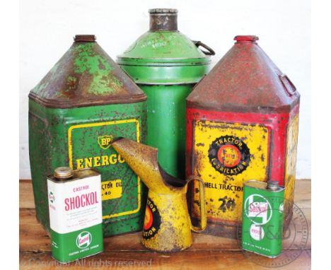 A selection of vintage oil cans and ewers, to include a BP Tractor oil canister, a Shell tractor oil, a large green Castrol m