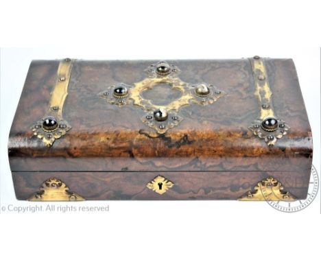 A Victorian burr walnut veneered games compendium with agate cabachon mounts, the rectangular brass bound case opening to rev