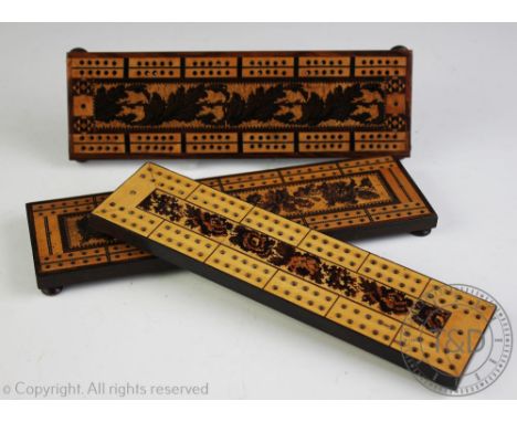 Three late 19th century Tunbridge Ware inlaid cribbage boards, one decorated with a central foliate panel and with parquetry 