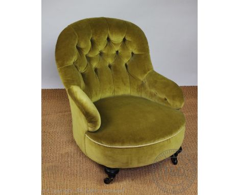 A late Victorian ebonised salon chair, with button back upholstery, on bun feet, 78cm H