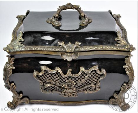 A modern gilt metal mounted ceramic casket and cover, in the 18th century French manner, of bombe form, on scroll feet, 28cm 