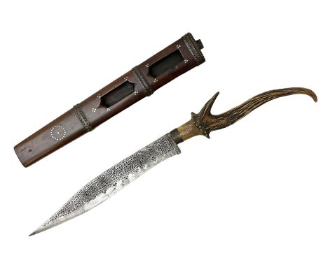 African tribal knife, possibly Shona Zimbabwe, the 22cm steel blade with all over punched decoration and antler handle; in in