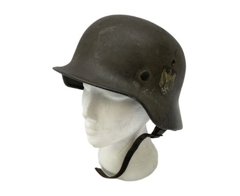 WW2 German single decal combat helmet, possibly M35, with liner and strap; impressed to skirt EF62 and 700Condition Report:Or