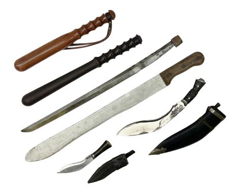 Small kukri with 11.5cm curving steel blade and horn grip; in leather scabbard L20cm overall; another larger Indian kukri in 