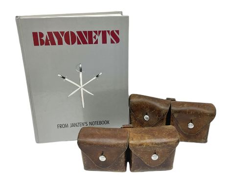 Two Swiss Schmidt-Rubin leather ammunition pouches, each with two compartments L18.5cm; and bayonet collectors reference book