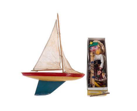 SCOTTISH AILSA MODEL YACHT,37cm long, along with a boxed 'Mitzi' Pelham Puppet (2)