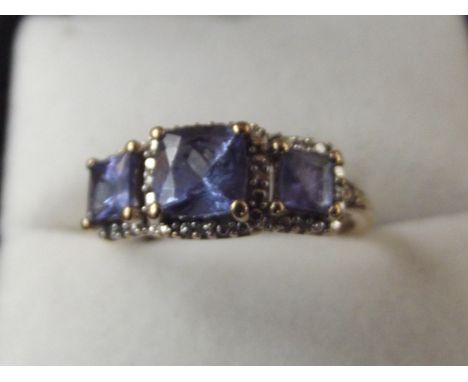 9 carat gold dress ring set with blue gemstones and diamonds, size S