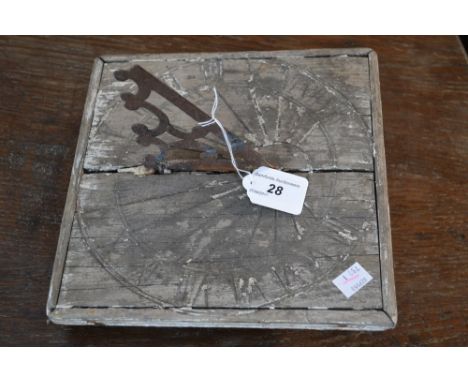 An early 20th century wooden sundial

