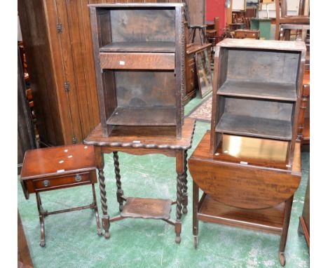 An oak barley twist occasional table; two oak bookcases; a reproduction sofa table of small proportions; a dropleaf tea troll