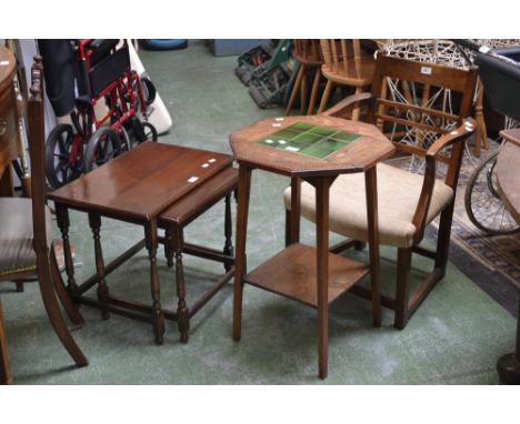 An oak open arm chair; an oak occasional table, tile inlaid octagonal top; a teak tile top table; an oak stool; an oak nest o