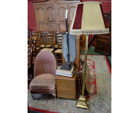 An eastern brass topped collapsible table; a brass standard lamp; an oak utility unit; a vintage upright Hoover vacuum cleane