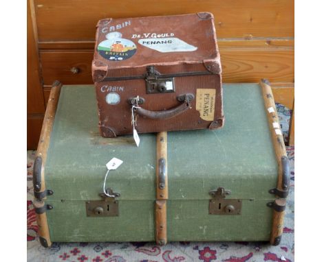 A vintage travel trunk and a vintage leather cabin holdall 