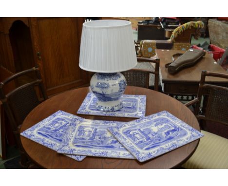 A large Spode blue and white Italian scene baluster table lamp; four similar table mats (5) 