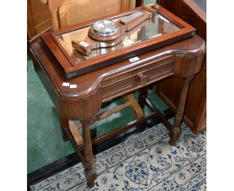 An oak side table with single drawer; a mahogany bevel edged mirror; a small oak barometer 