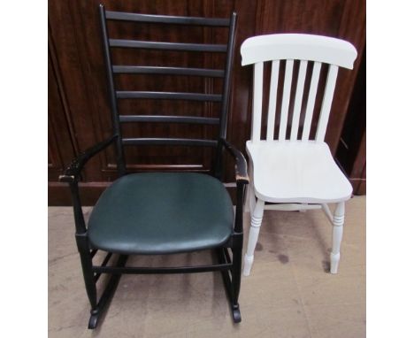 A ladder back rocking chair together with a white painted kitchen chair