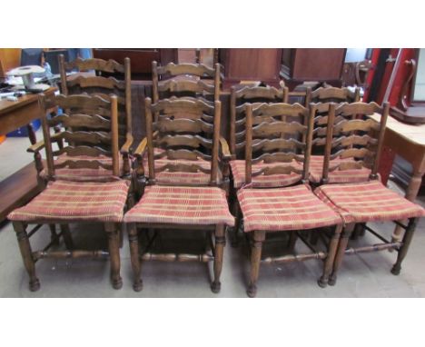 A set of eight 19th century style ladder back dining chairs with rush seats on turned legs