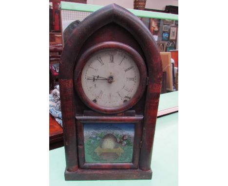 An American mantle clock of pointed arched form with Roman numerals with a printed panel with a beehive skep and flowers