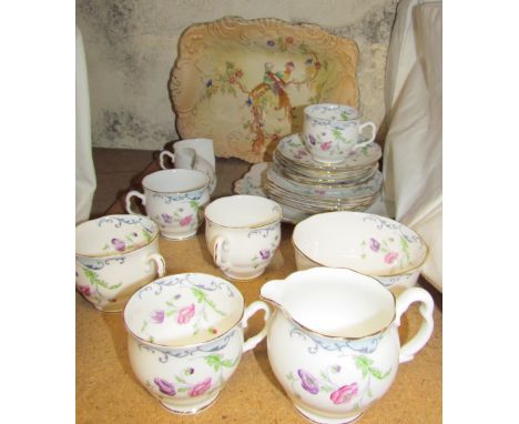 A Royal Albert floral decorated part tea service together with a pottery dish