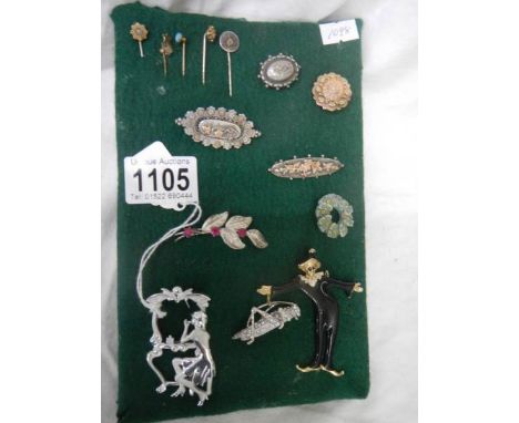 A good lot of brooches and stick pins including some silver.