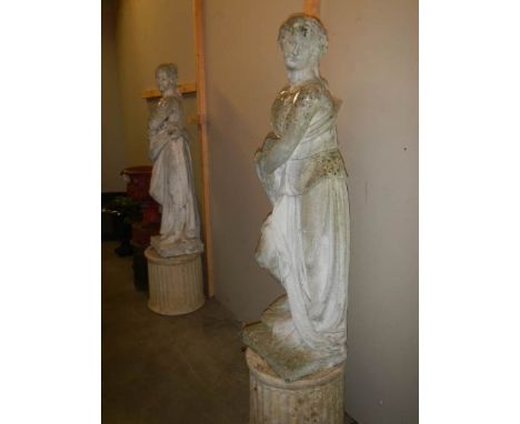 A pair of tall garden statues on plinths, COLLECT ONLY.Height of Stature is 125cm.Base Height 42cm.Celephane is to hold lot n