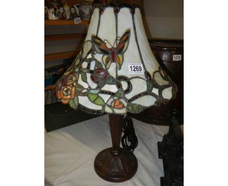 A table lamp with Tiffany style butterfly shade,.