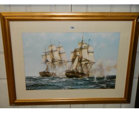 A framed and glazed print featuring sailing ships.
