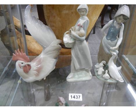 Two Lladro figures and a Lladro cockerel.