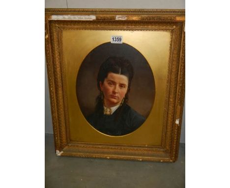 An early 20th century framed and glazed portrait of a lady.