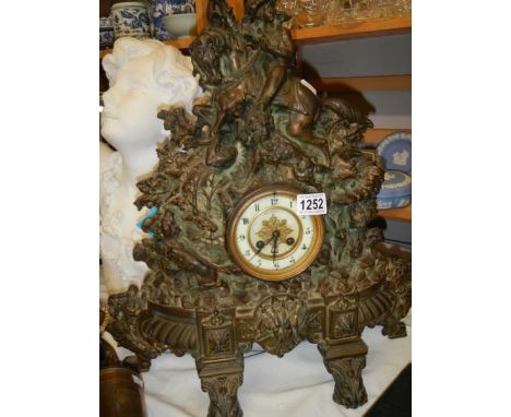 A heavy spelter mantel clock.