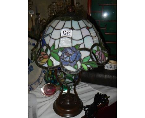 A table lamp with Tiffany style shade.