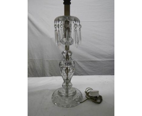 A Victorian cut glass table lamp.