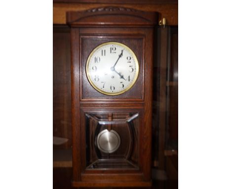 Oak cased wall clock 
