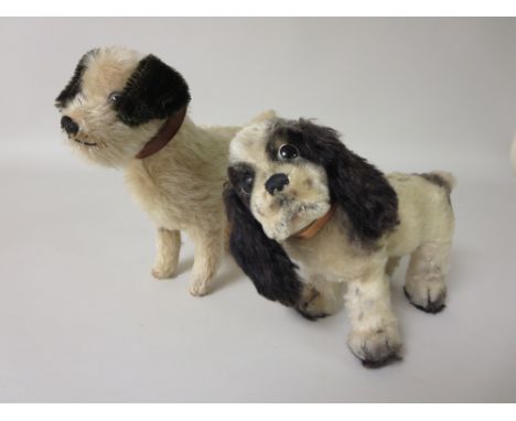 A Steiff black and white King Charles Spaniel 9in L and a cream and black English made Terrier 10in L