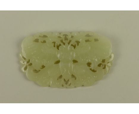 A 19th Century Chinese celadon jade Plaque Pendant  carved and pierced with a butterfly amongst foliate scrolls, 3 1/2in